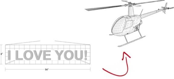 Helicopter with Valentines Day messages flying in the sky